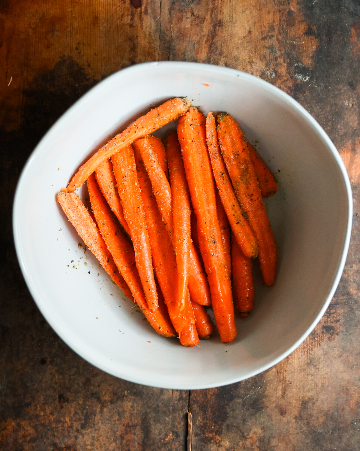 overhead seasoned carrots in bowl