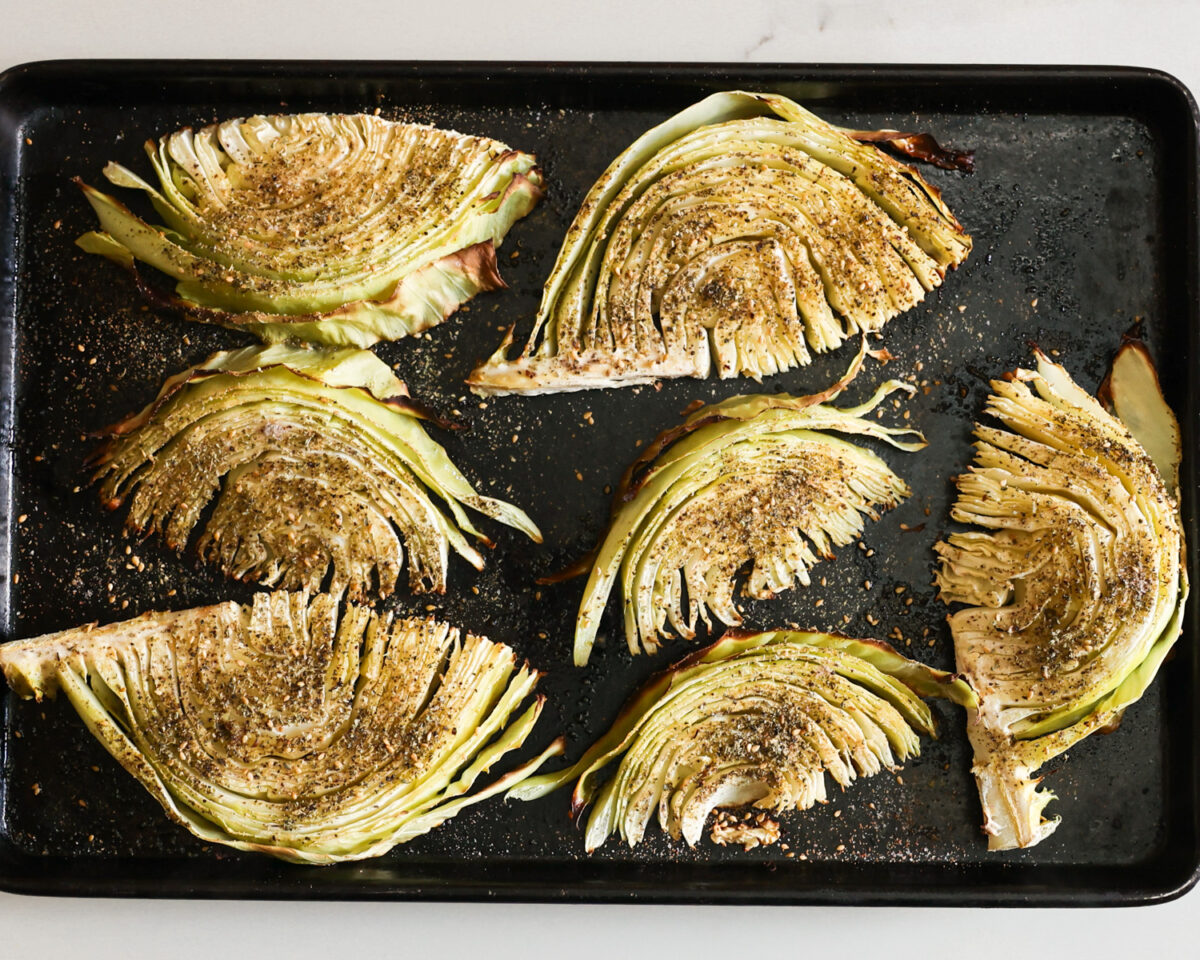 Roasted cabbage on a baking sheet.