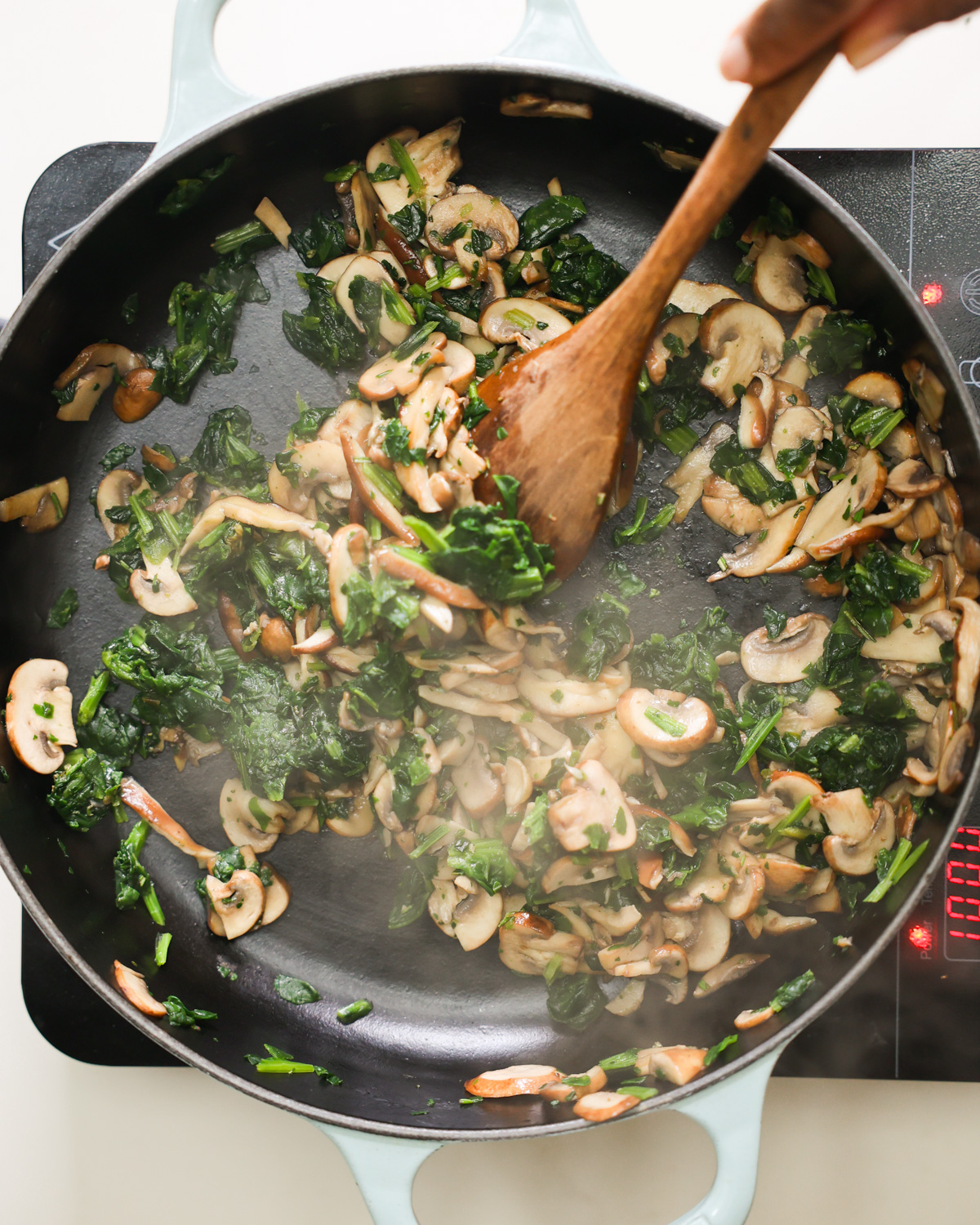 sautéing mushrooms and spinach