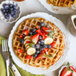 plated vegan waffles topped with fresh fruit
