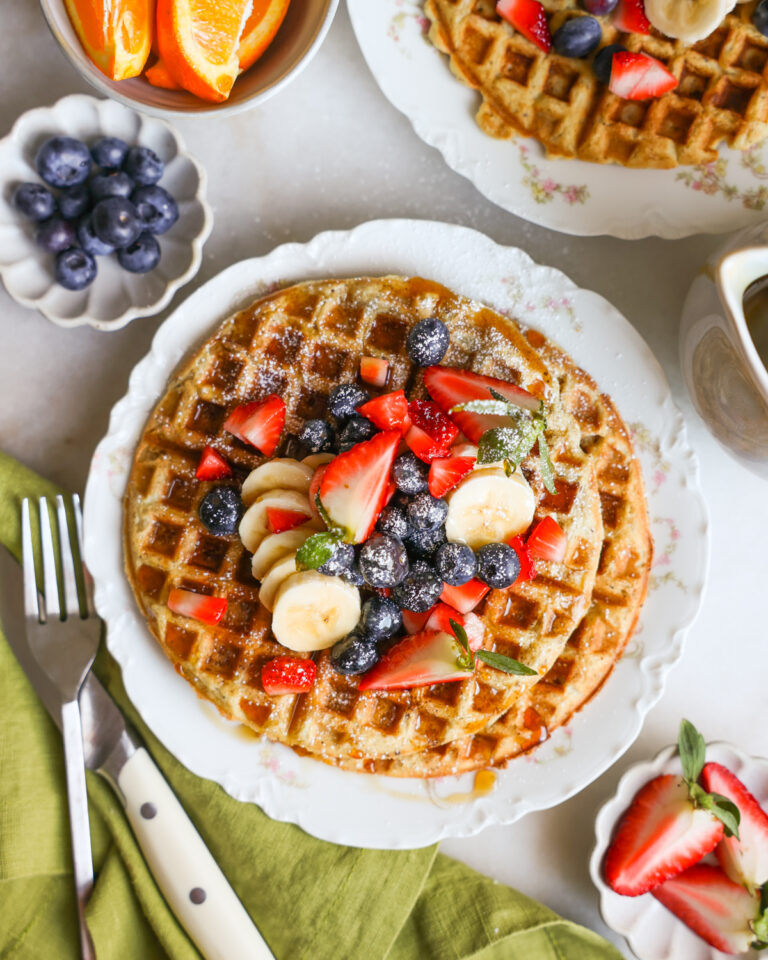 plated vegan waffles topped with fresh fruit