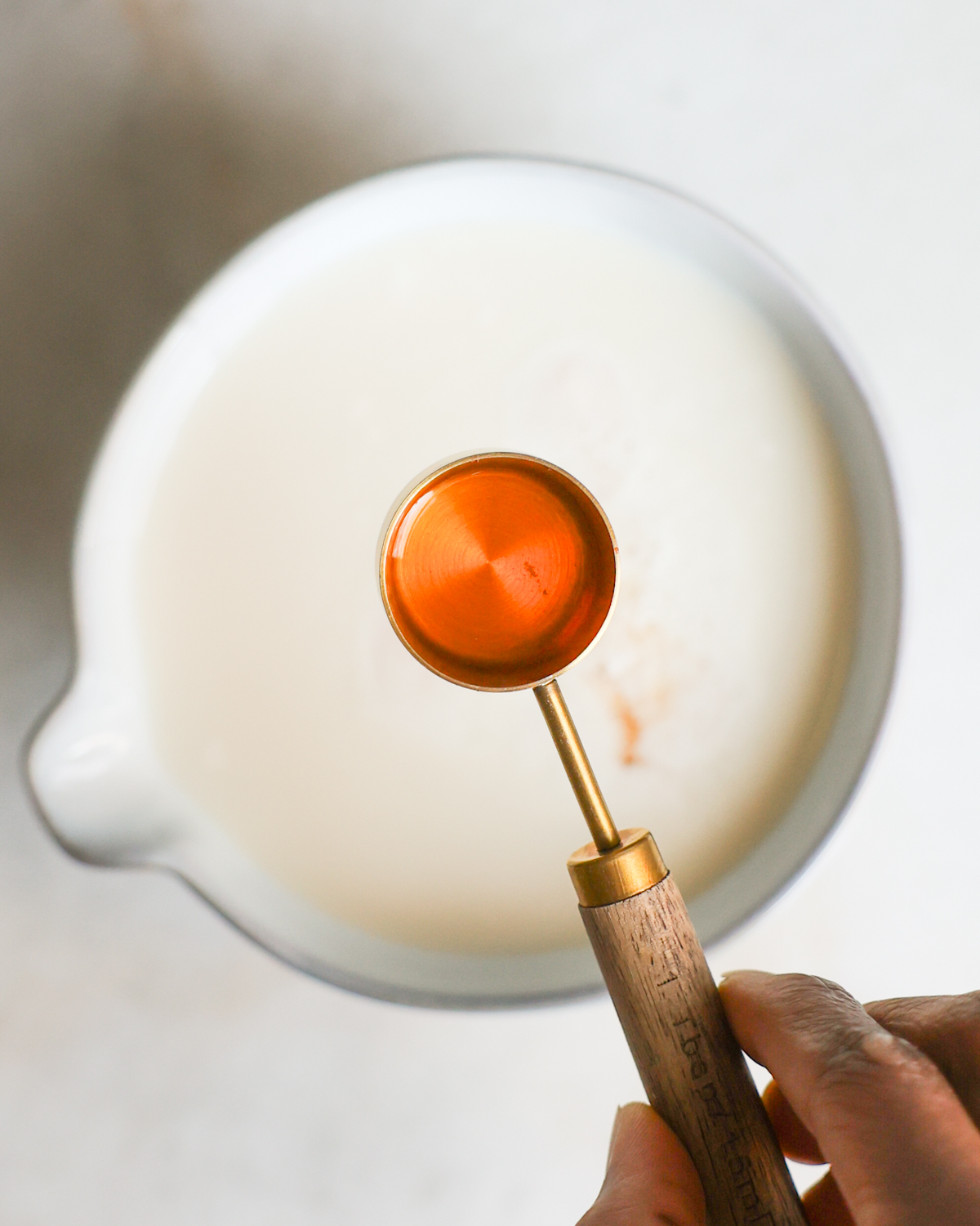 overhead of vinegar and soy milk