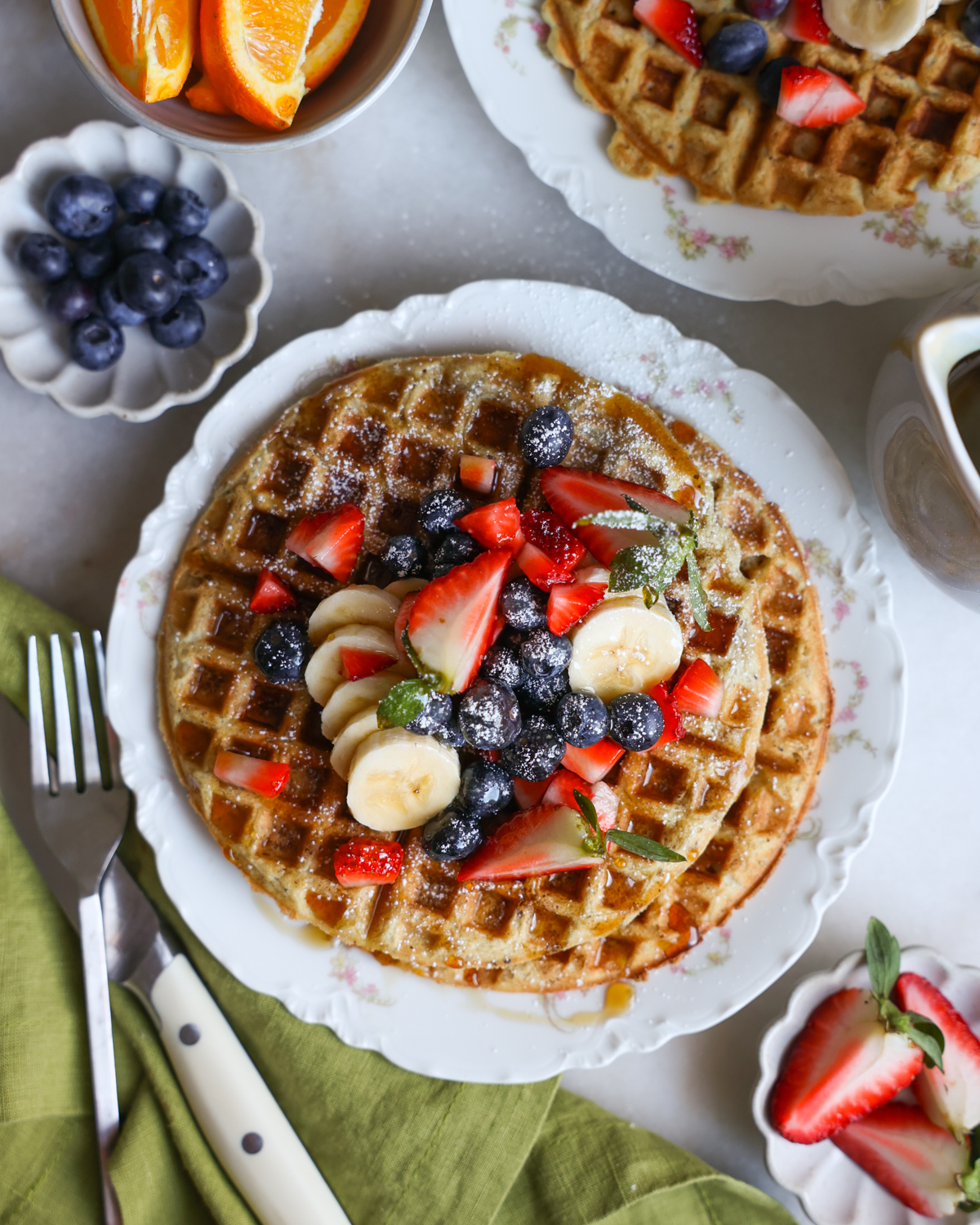 plated vegan waffles topped with fresh fruit