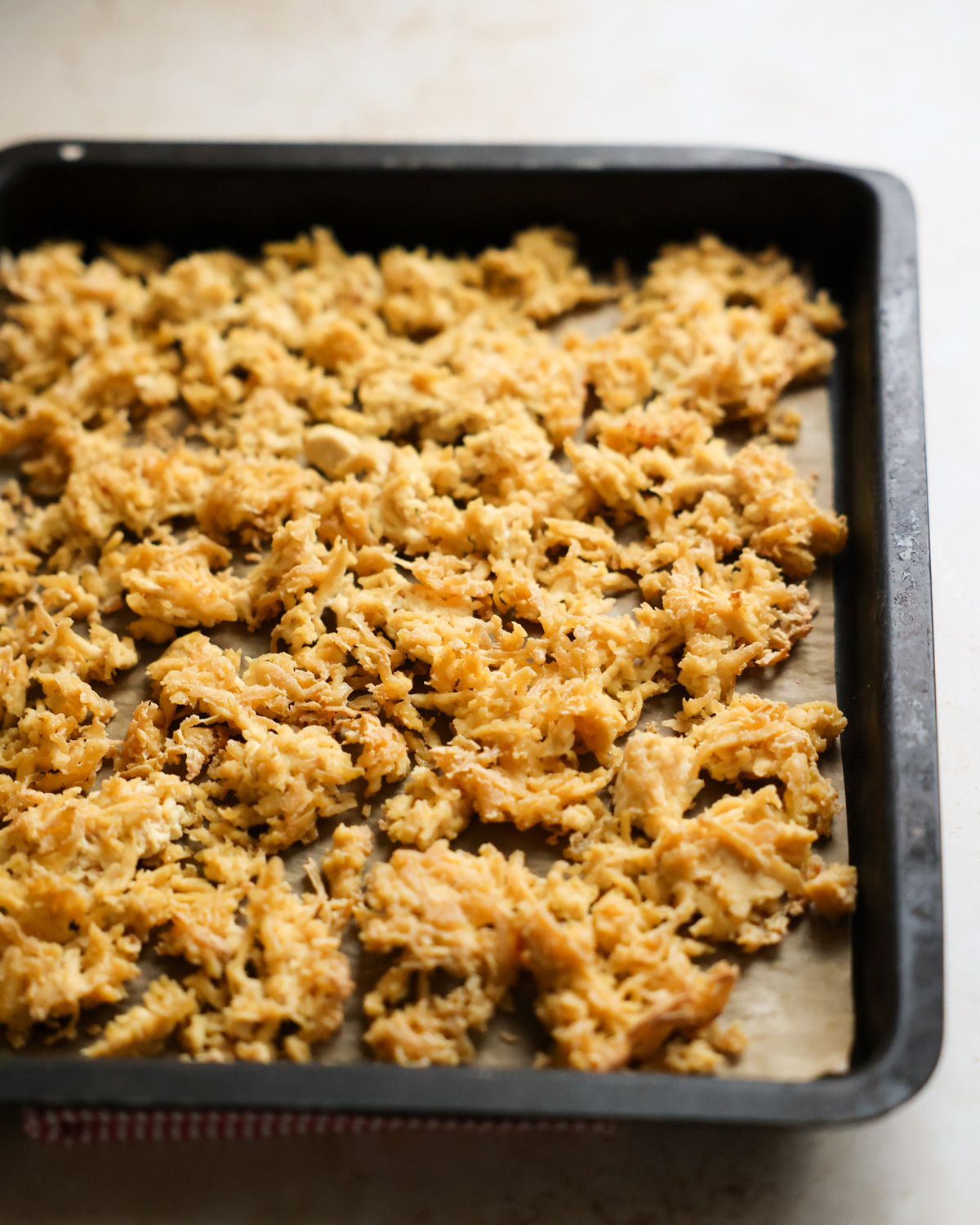 shredded tofu on baking sheet