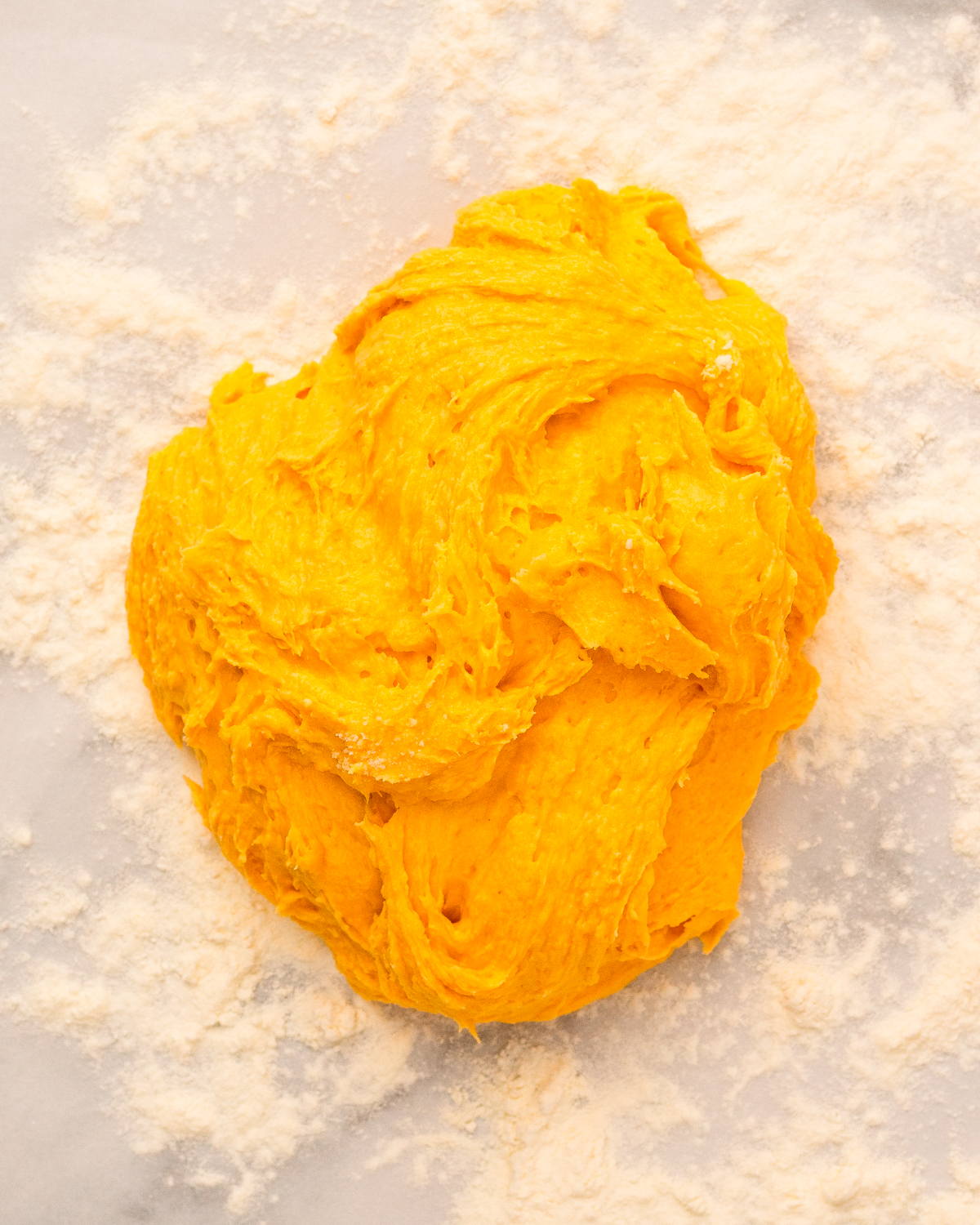 sticky biscuit dough on floured counter