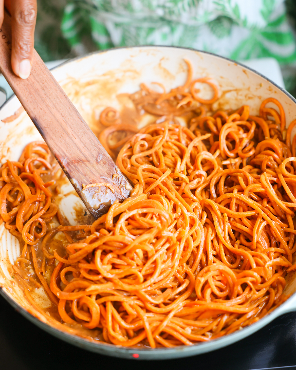 stirring sweet potato noodles