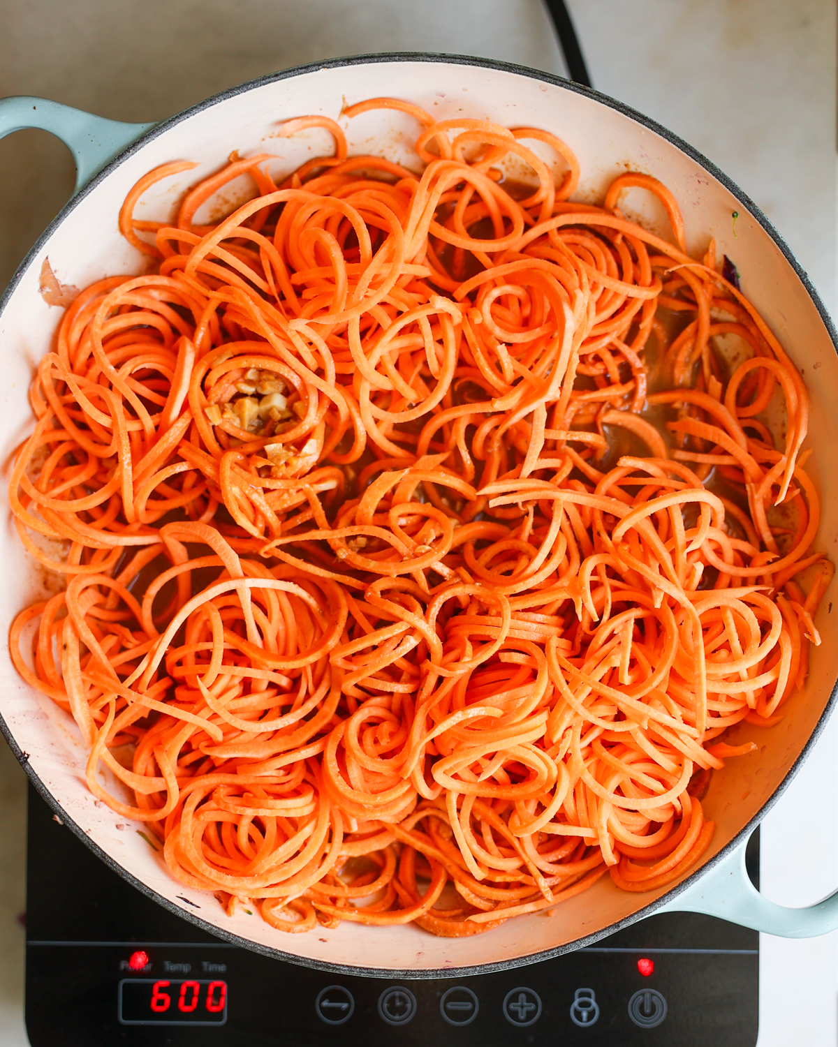 spiralized sweet potato noodles in pan