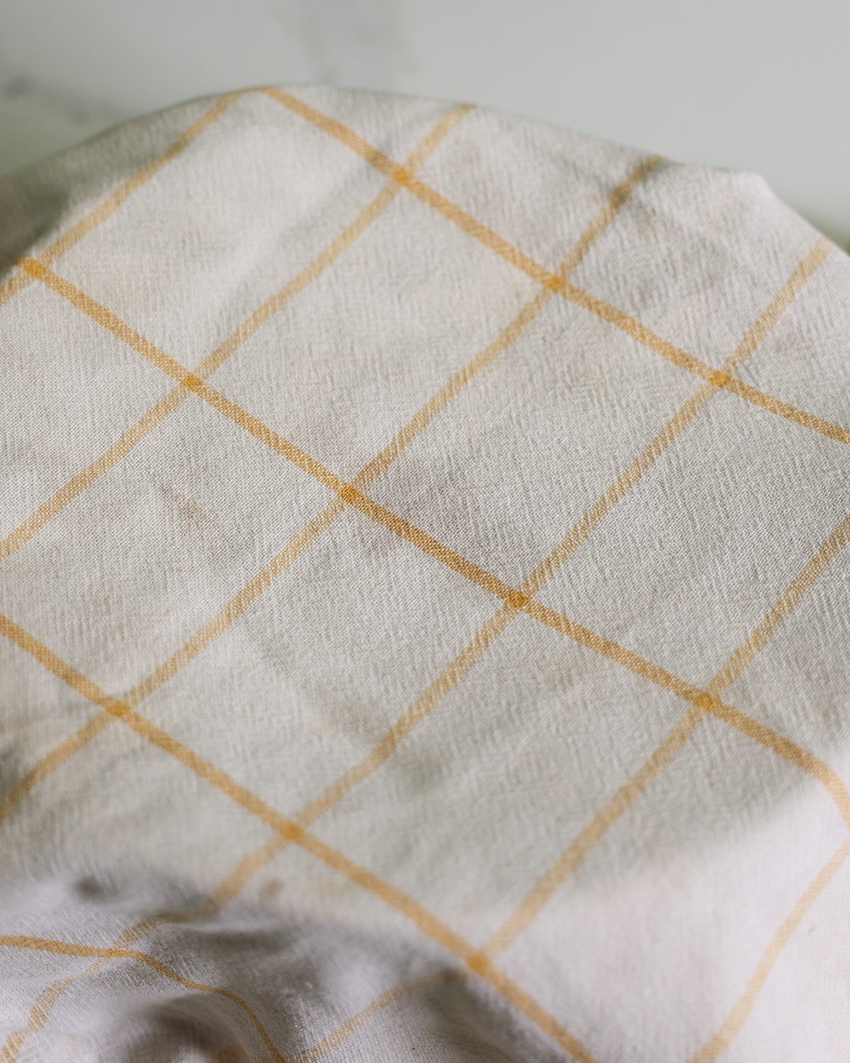 overhead of bowl covered with a towel