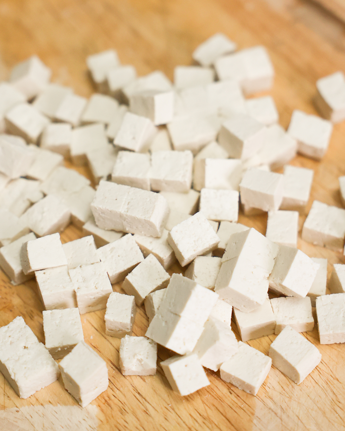 cubed tofu on cutting board