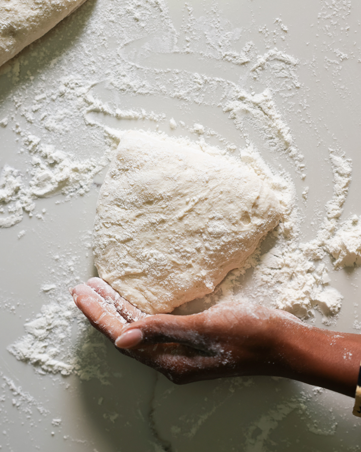 overhead dough shaping