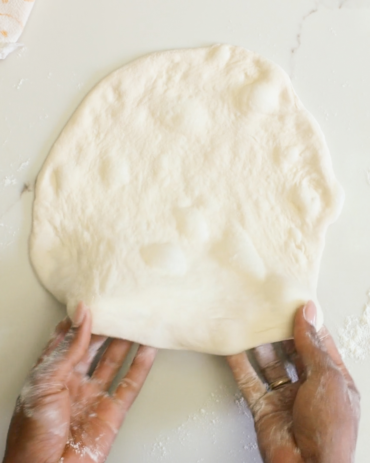 shaping sourdough pizza