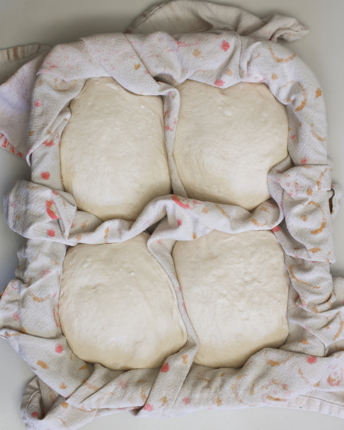 rested dough in tray