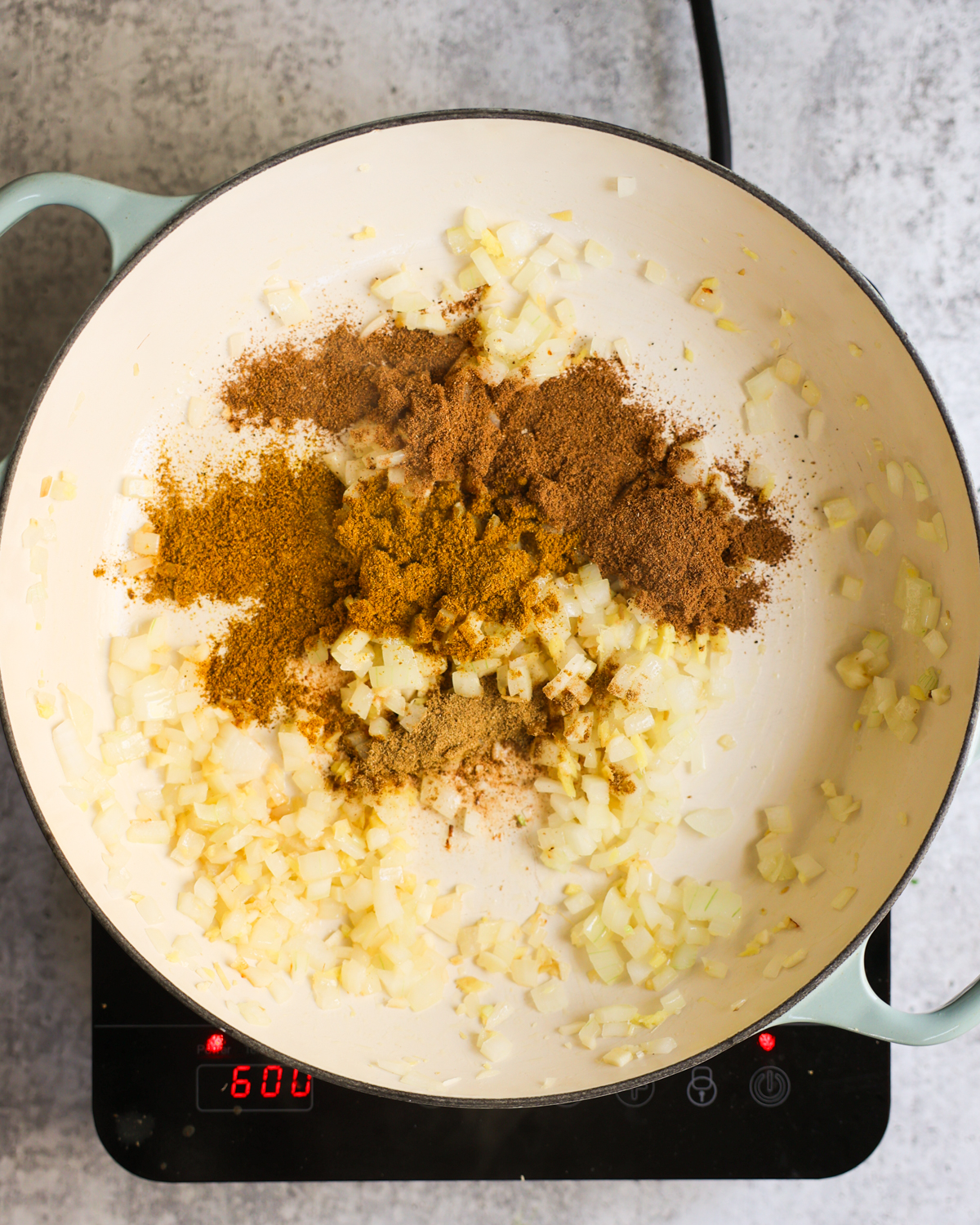 overhead spices added to pan