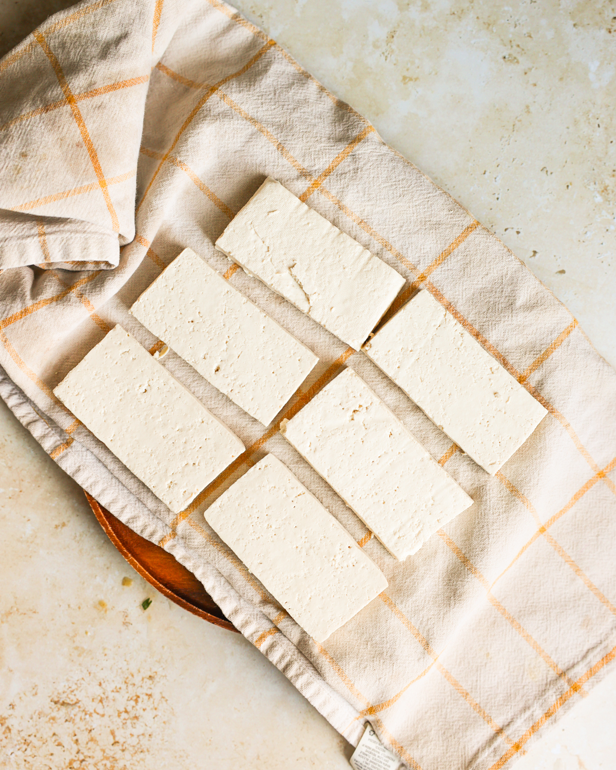 tofu on towel before pressing