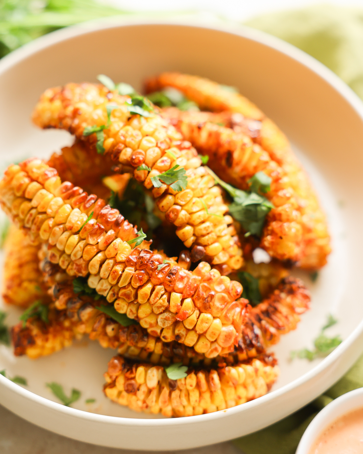 garnished corn ribs on plate