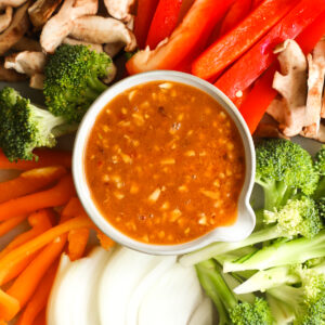 Stir Fry Sauce in bowl surrounded by veggies