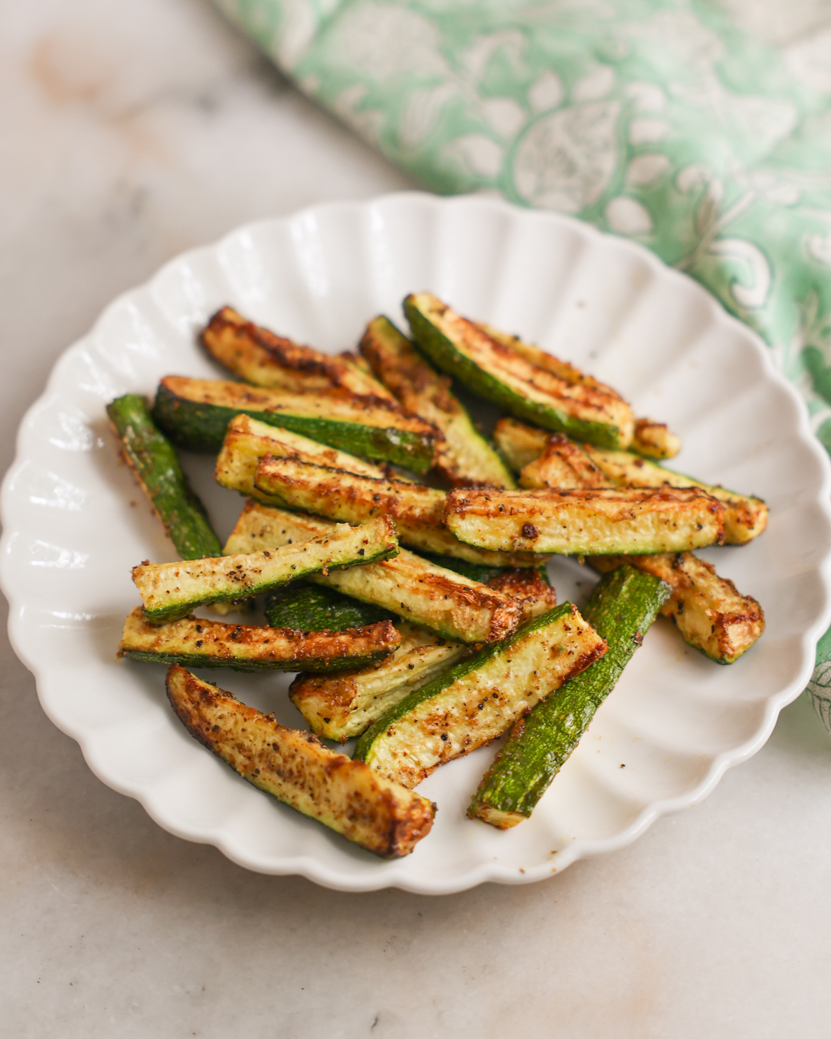 A plate of air fryer zucchini spears.