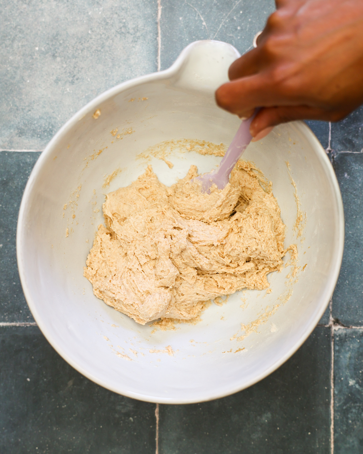 mixing dough in a bowl