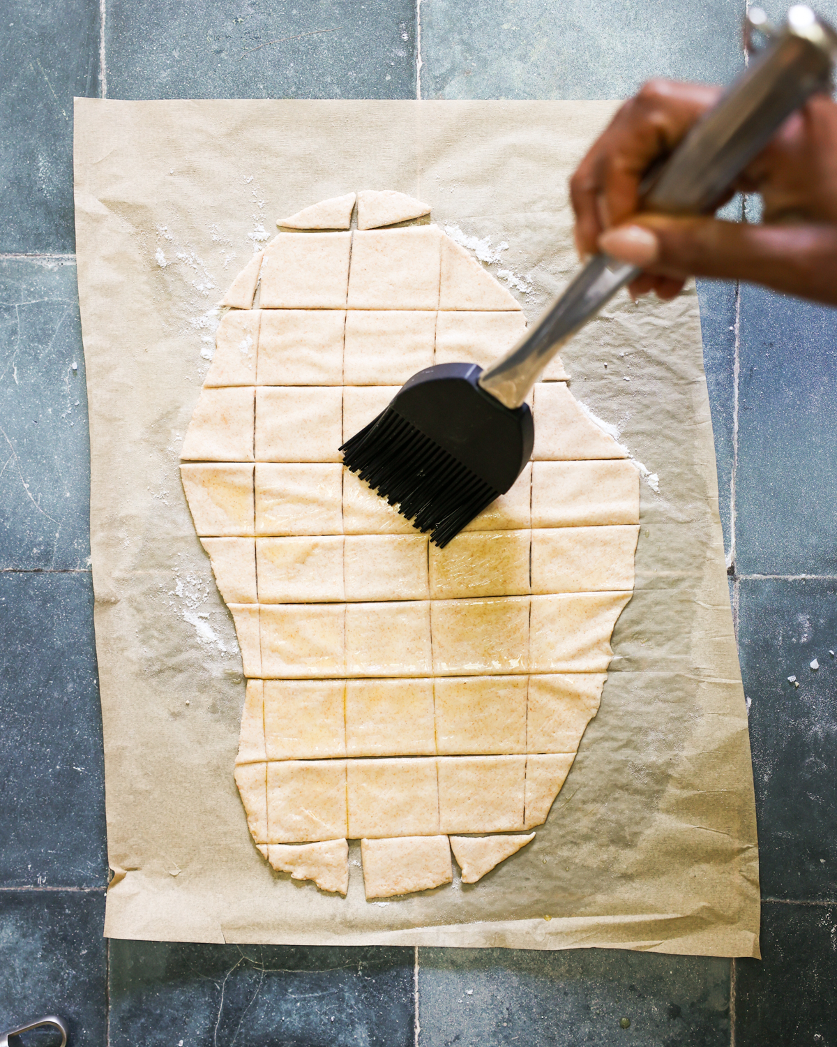 brushing crackers with oil