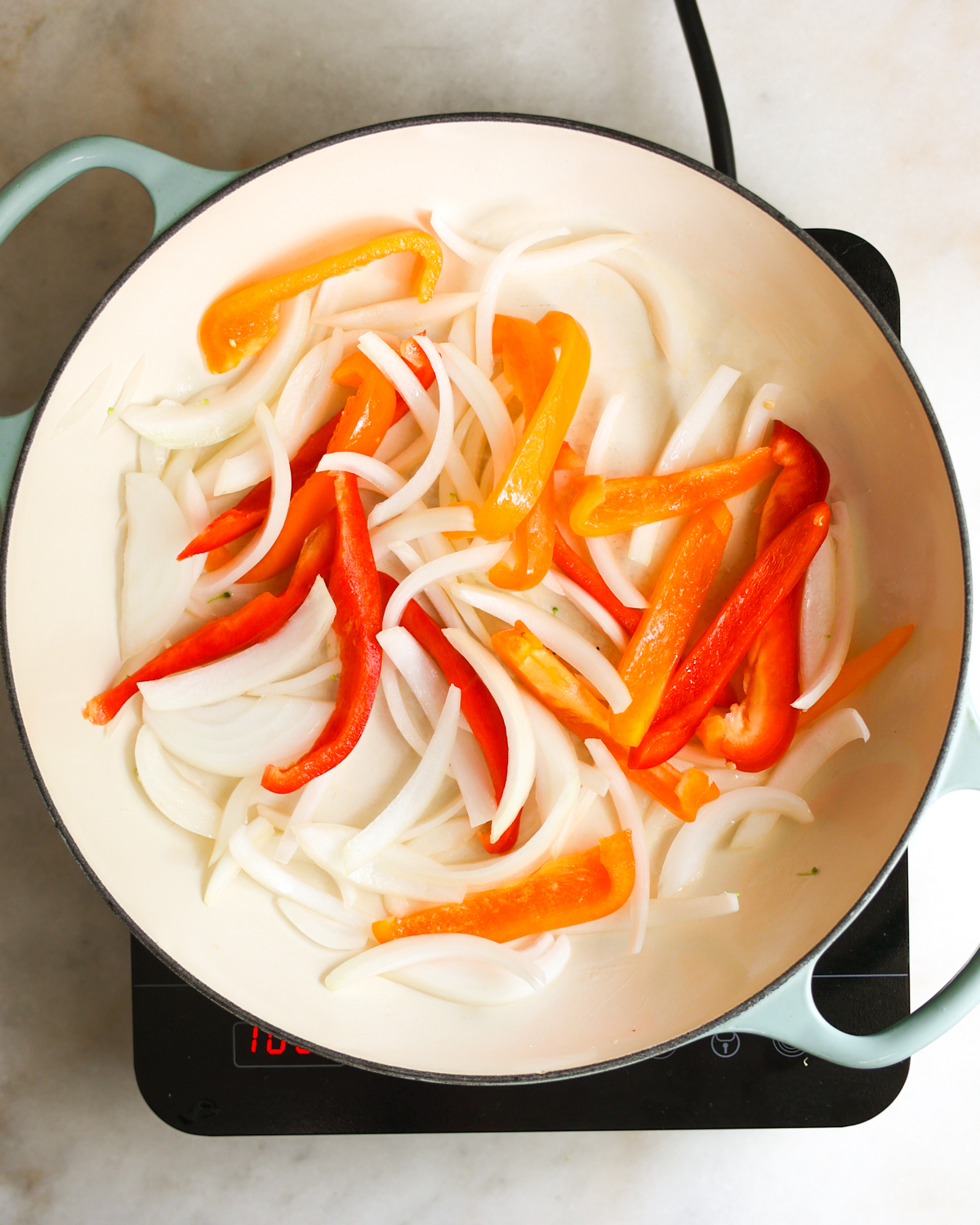 onions and bell pepper sautéing 