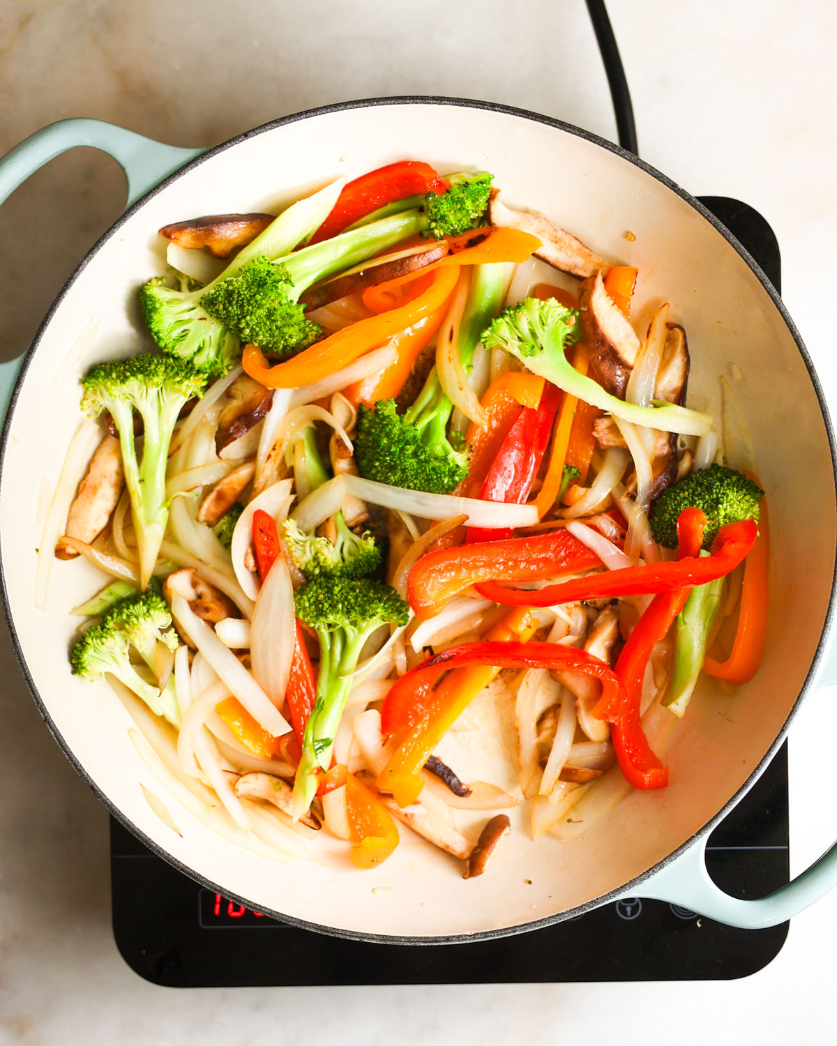 veggies added to skillet overhead