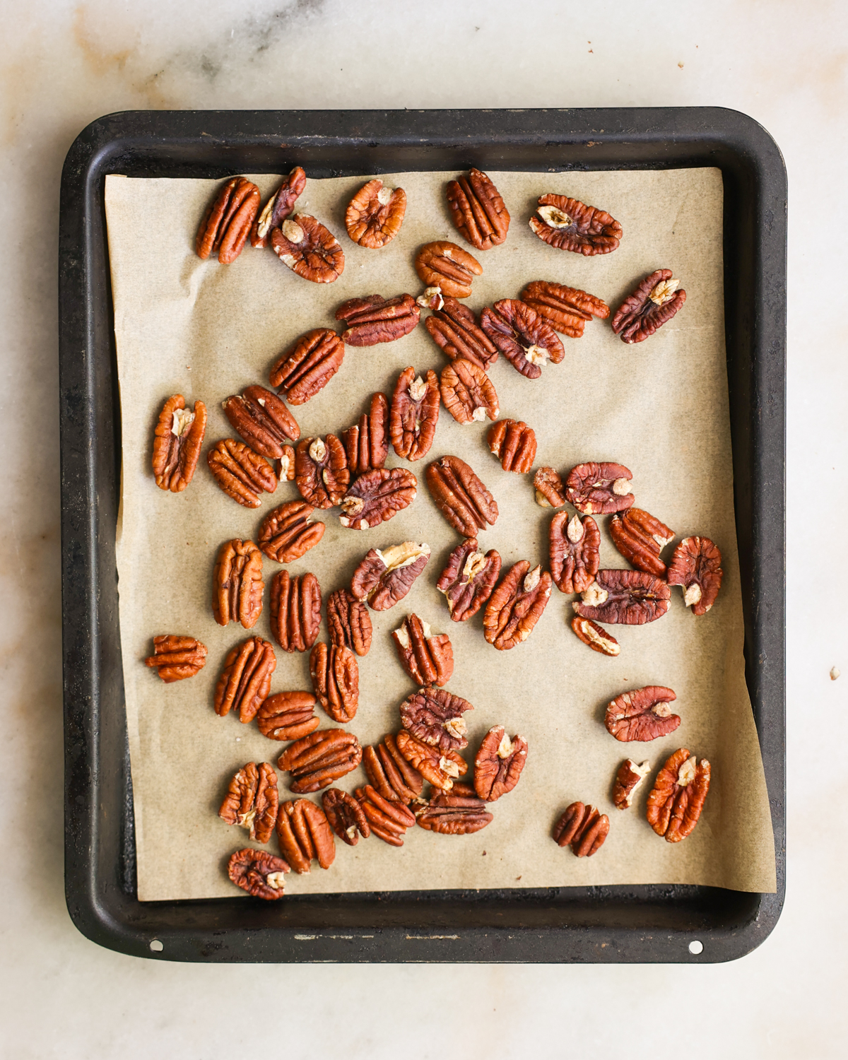 overhead toasted nuts on baking sheet
