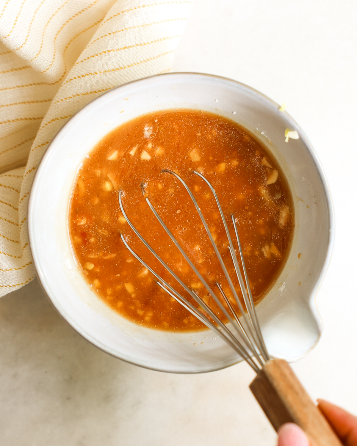 overhead whisking sauce