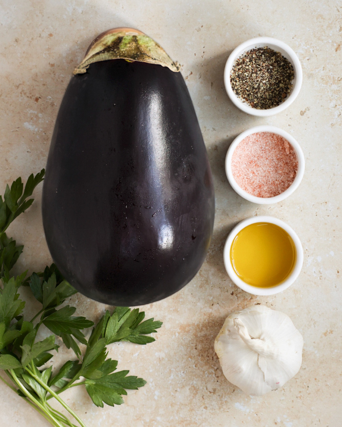 All the ingredients needed to make air fryer eggplant on the counter.