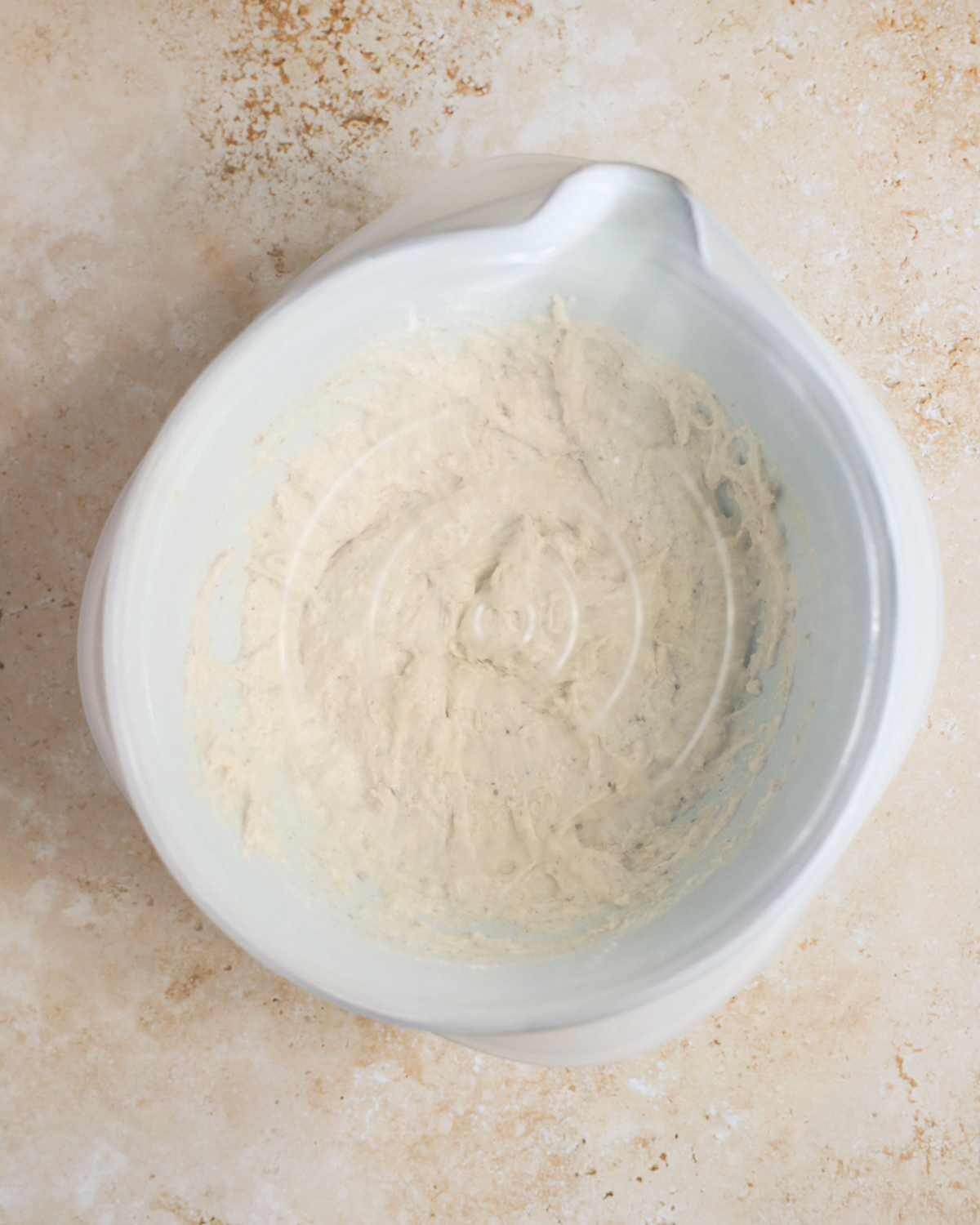 A covered mixing bowl of the sourdough discard pancake batter.