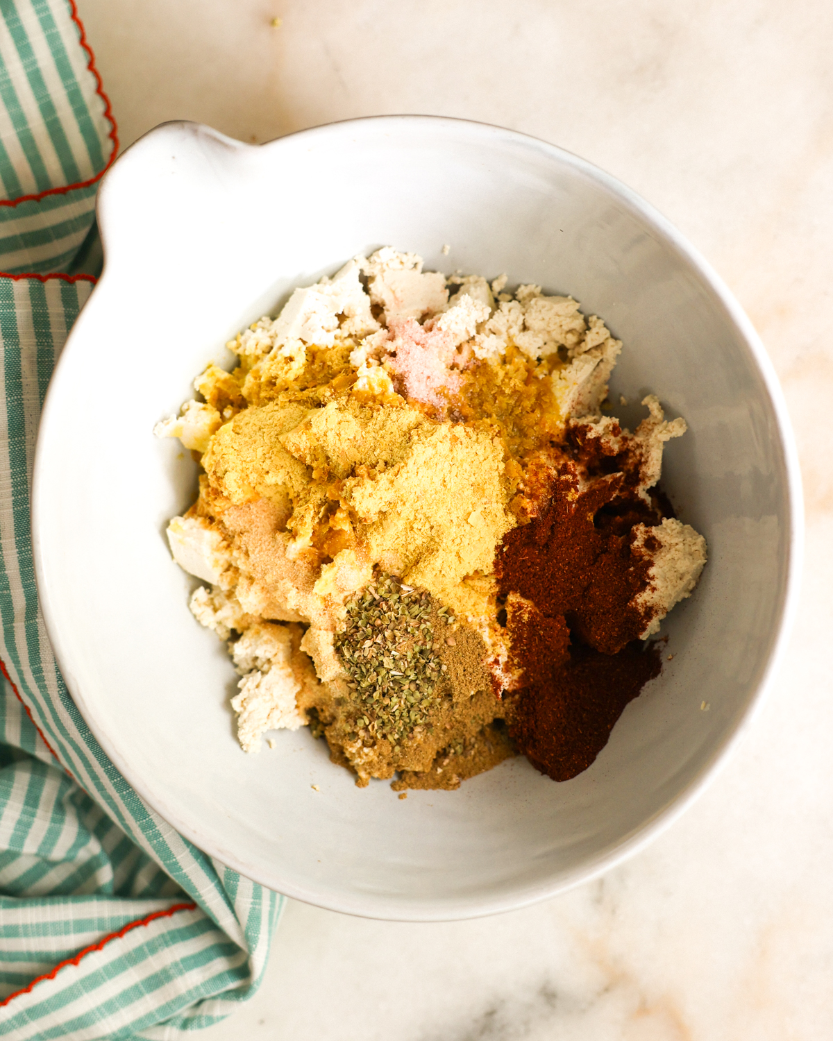 spices added to crumbled tofu