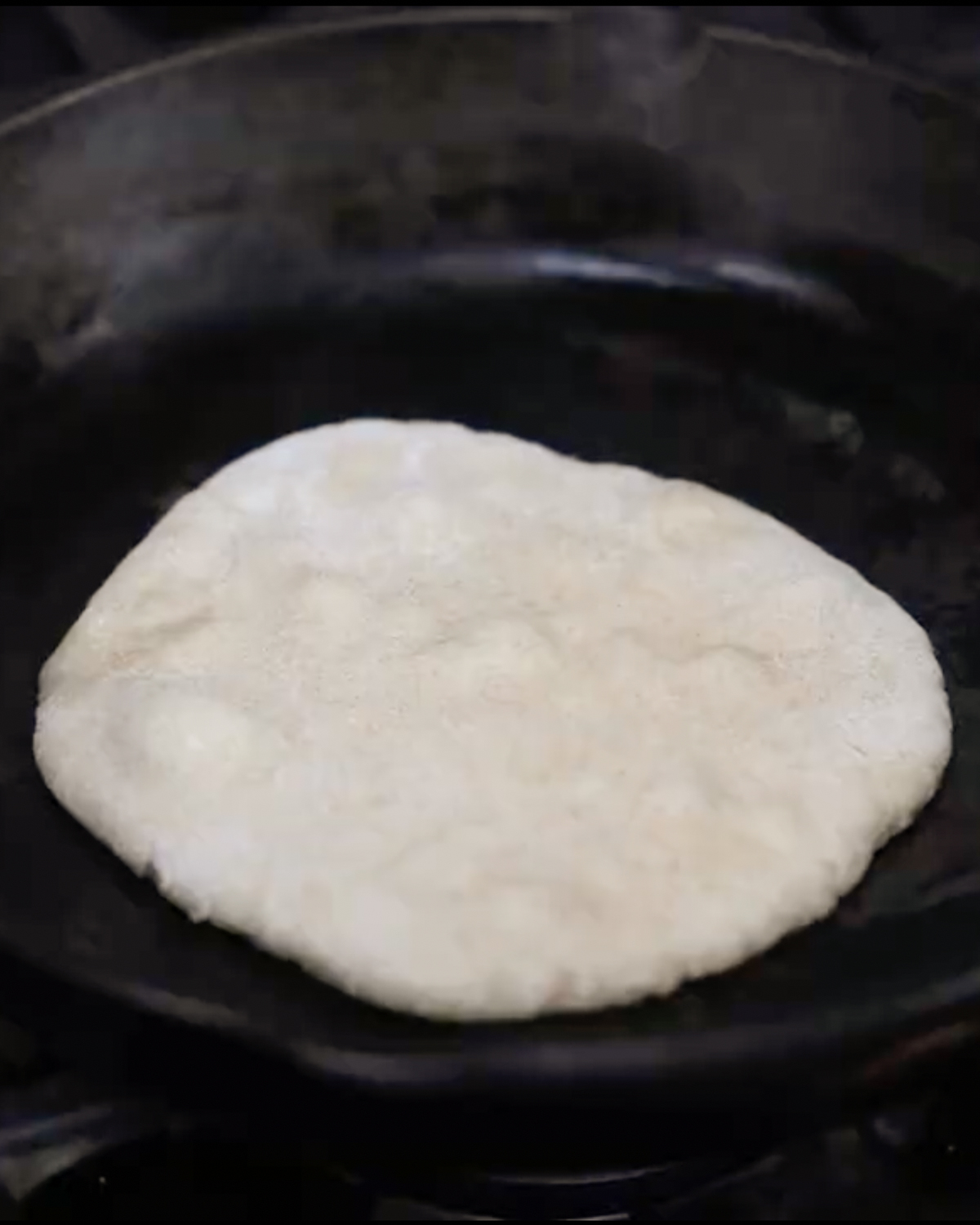 naan bubbling on skillet