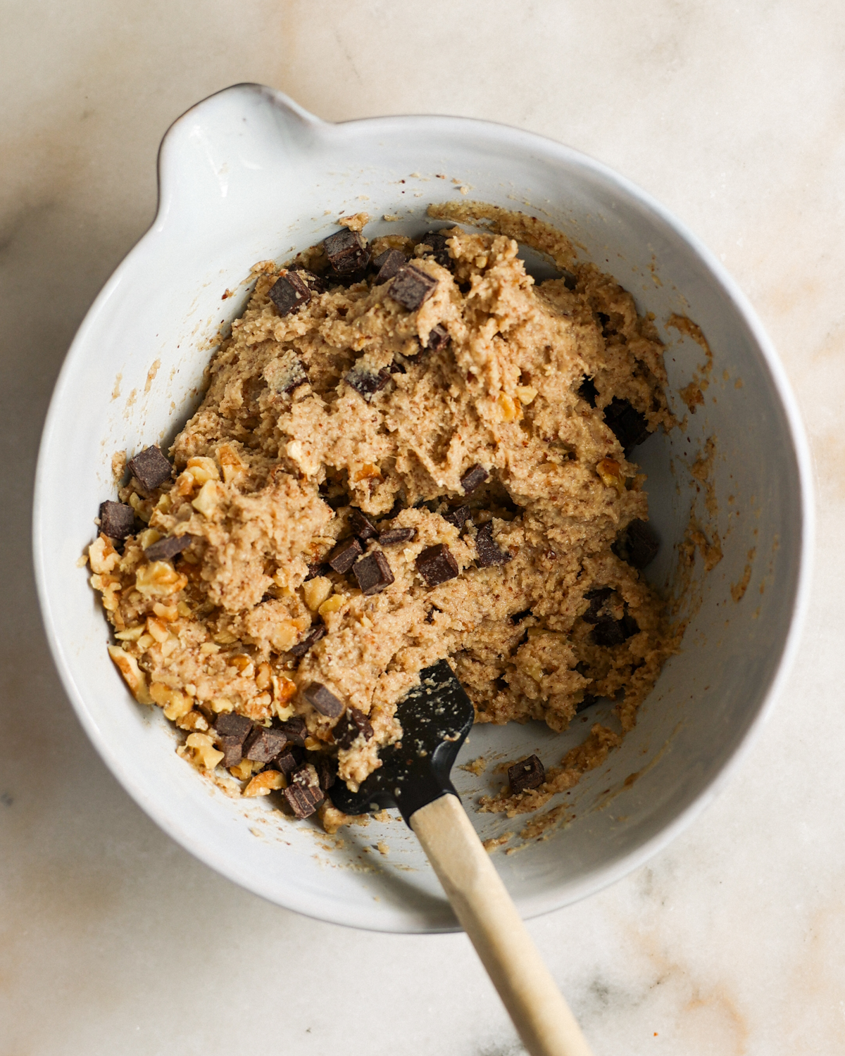 folding chocolate chips into batter