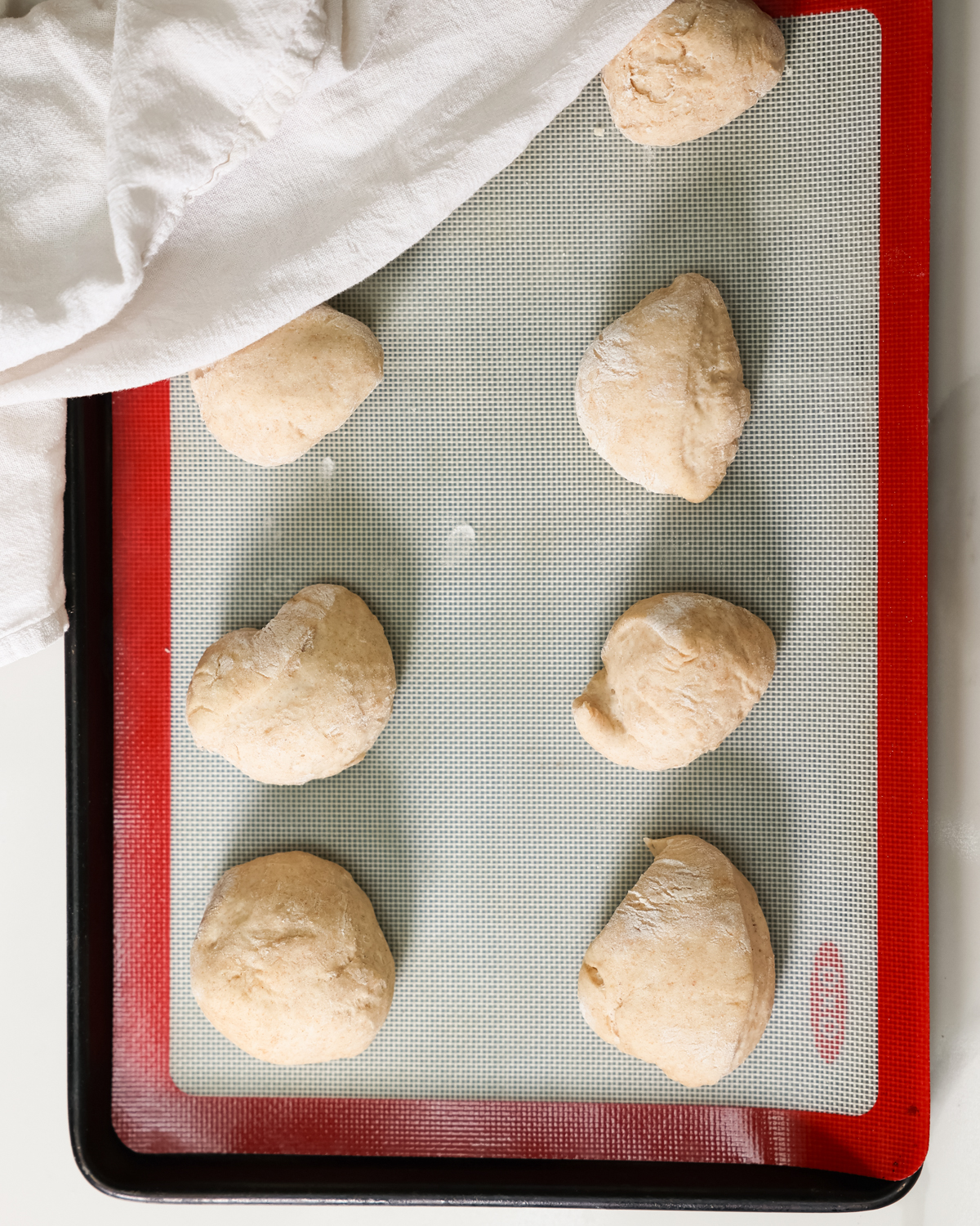 naan balls on baking sheet