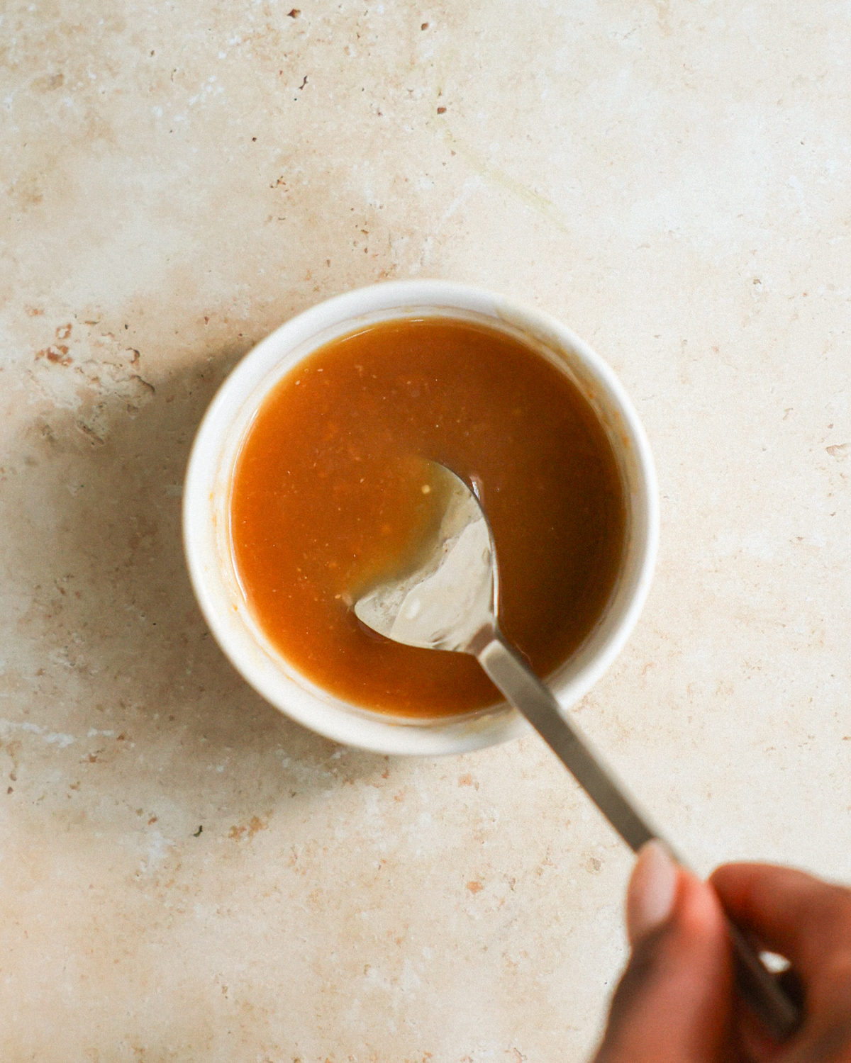 overhead stirring sweet carrot glaze
