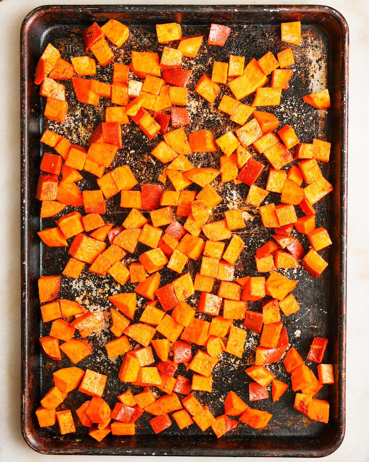 sweet potatoes on baking sheet