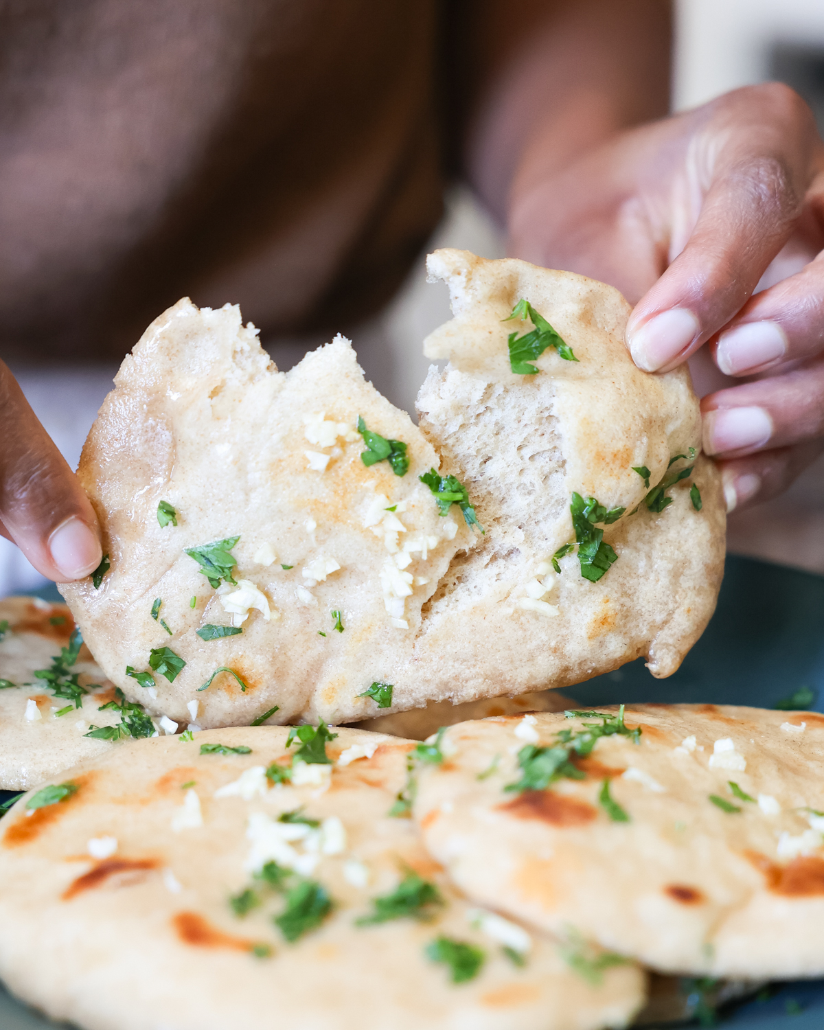 tearing naan in half