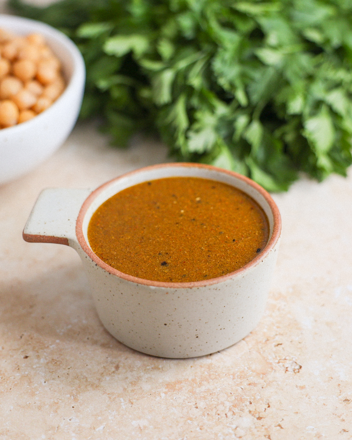 curry vinaigrette in measuring cup