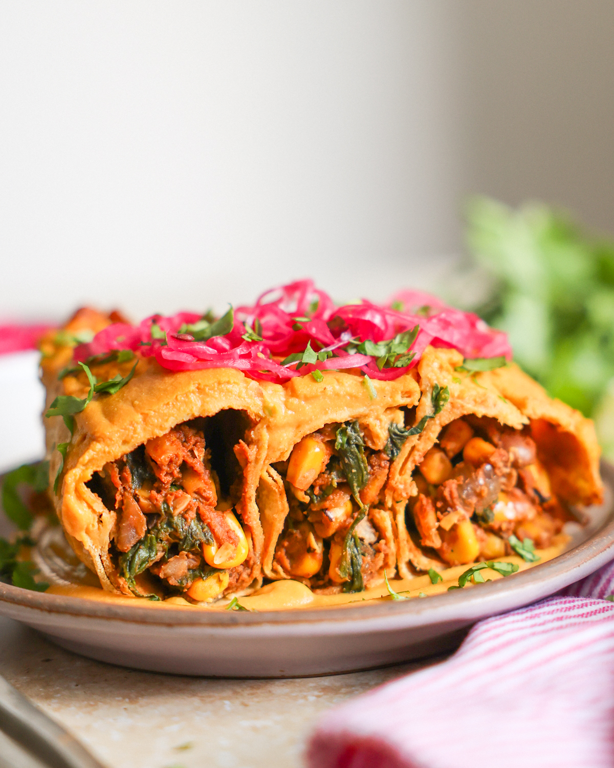 enchiladas topped with pickled onions