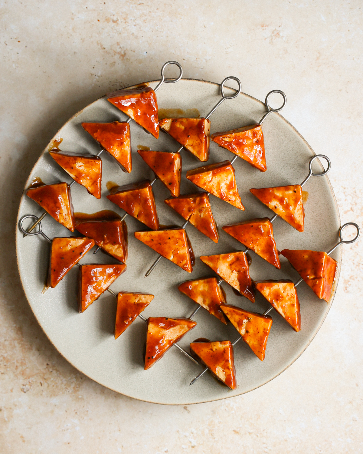 overhead marinated tofu on skewers