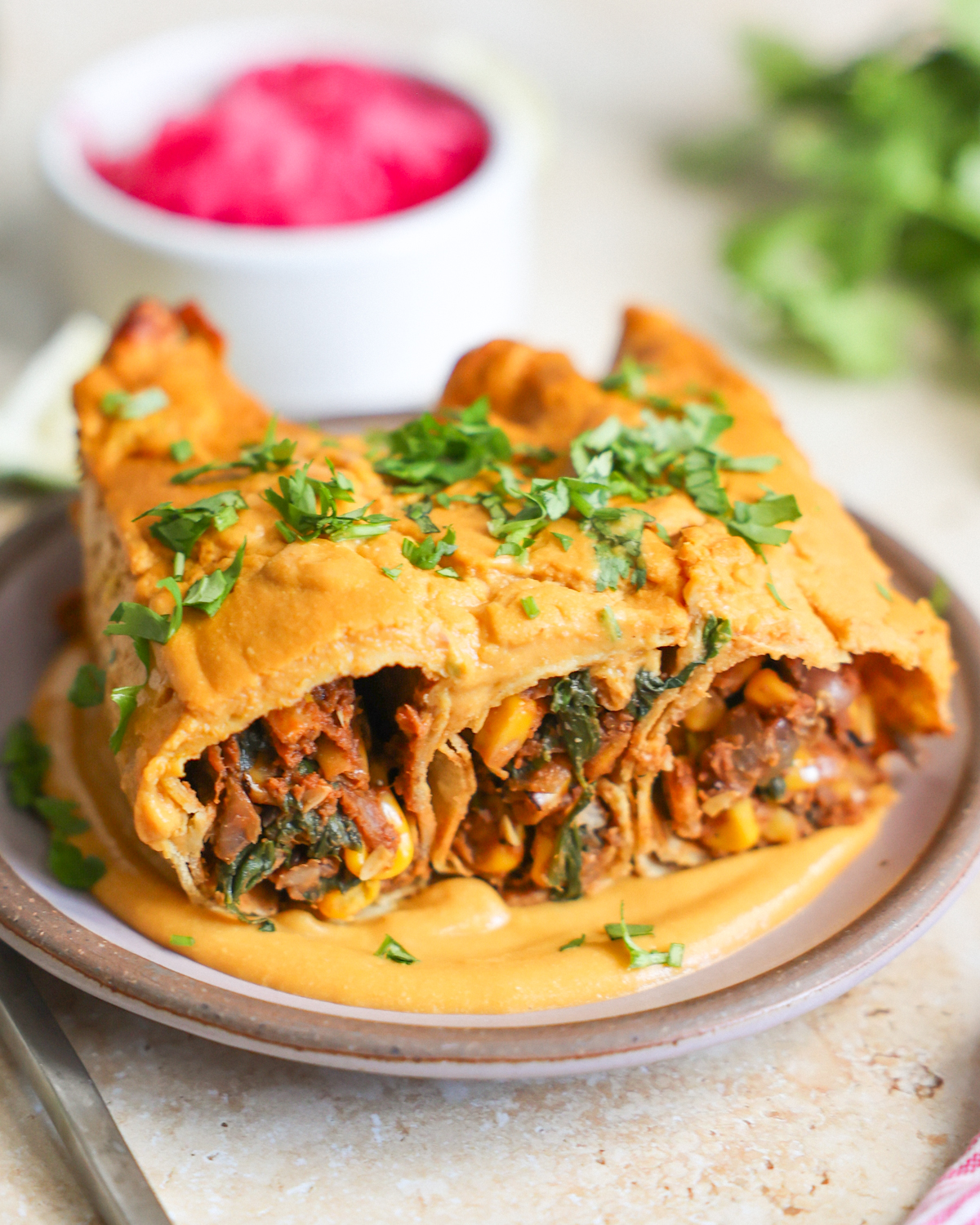 vegan sweet potato enchiladas on plate