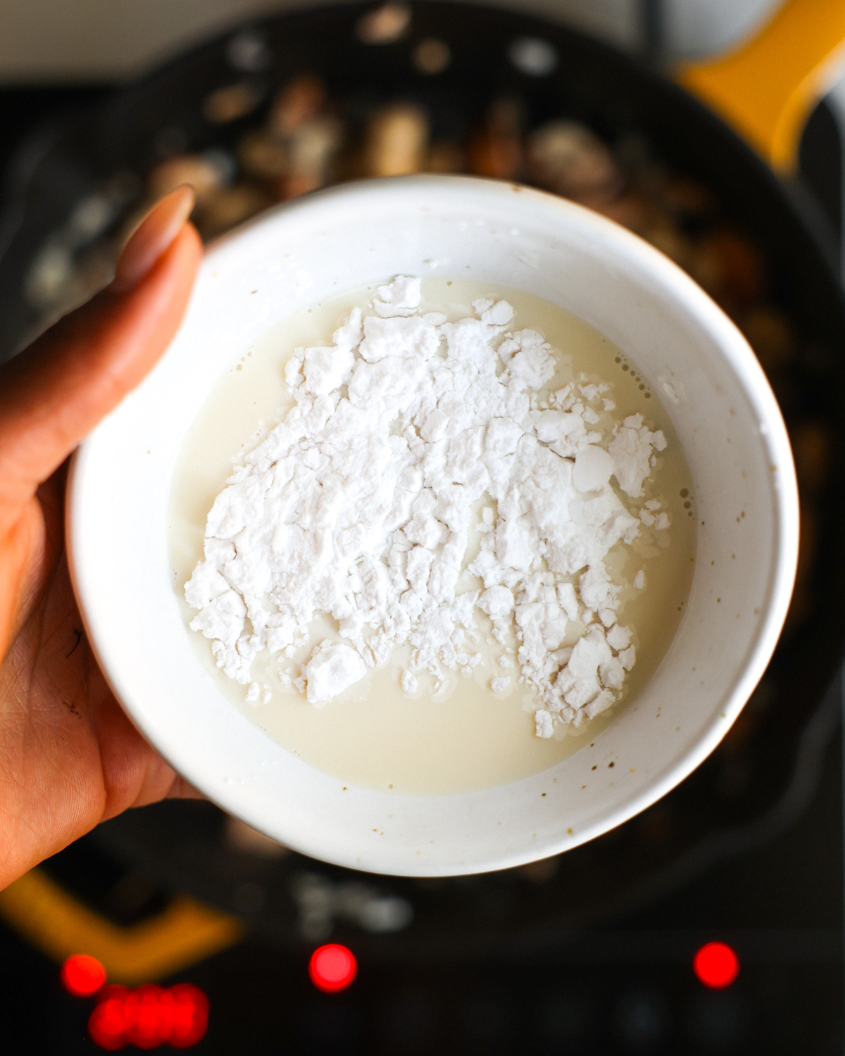 overhead soy milk and cornstarch in hand