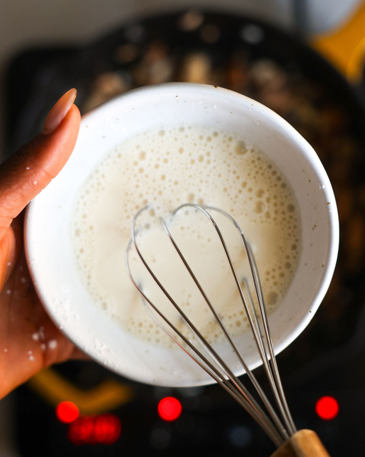overhead whisking cornstarch slurry