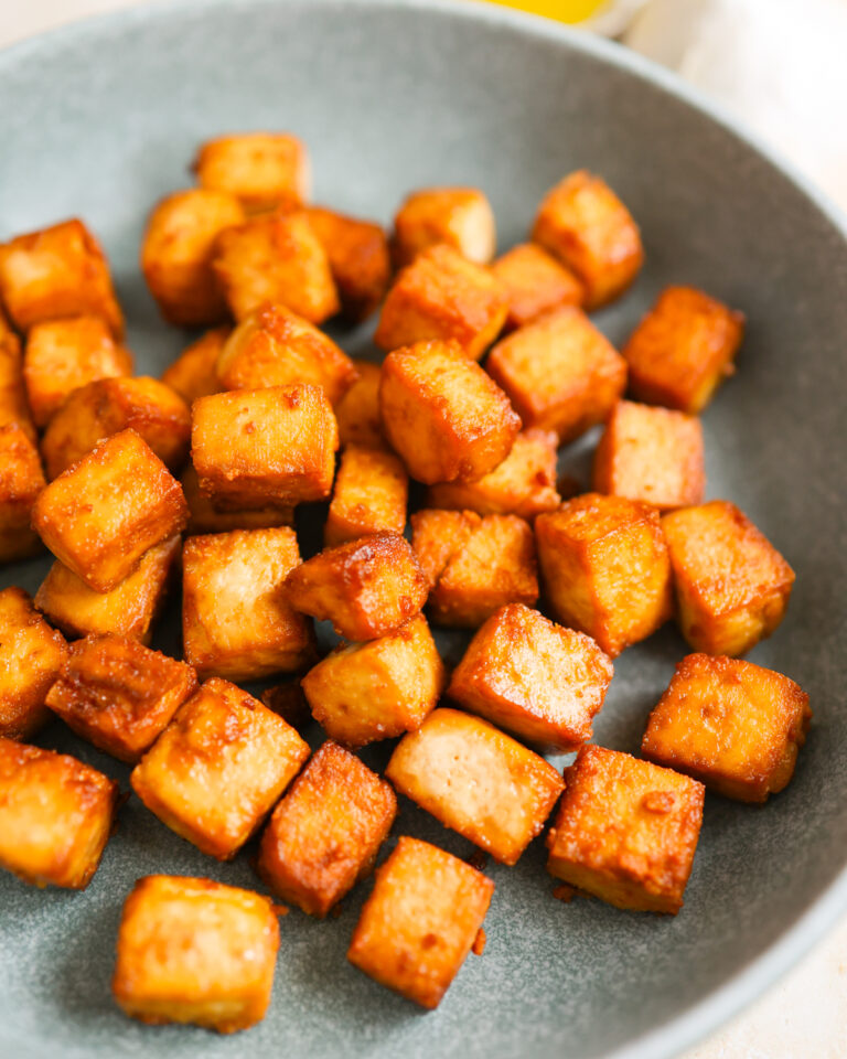 Air fried tofu on a plate.