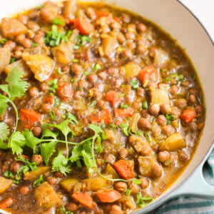 A close-up shot of a large pot of Jamaican chickpea curry.