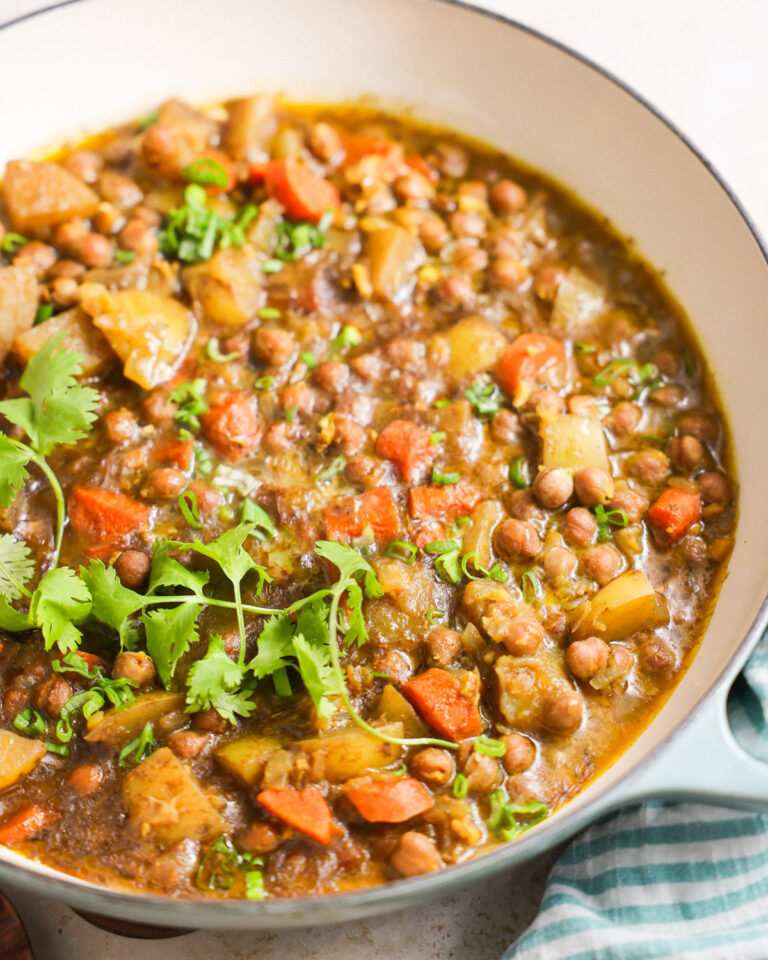 A close-up shot of a large pot of Jamaican chickpea curry.