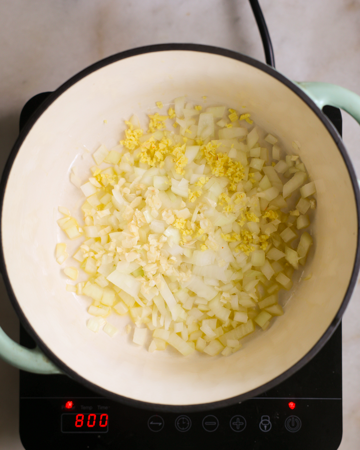 overhead sautéeing aromatics in pot