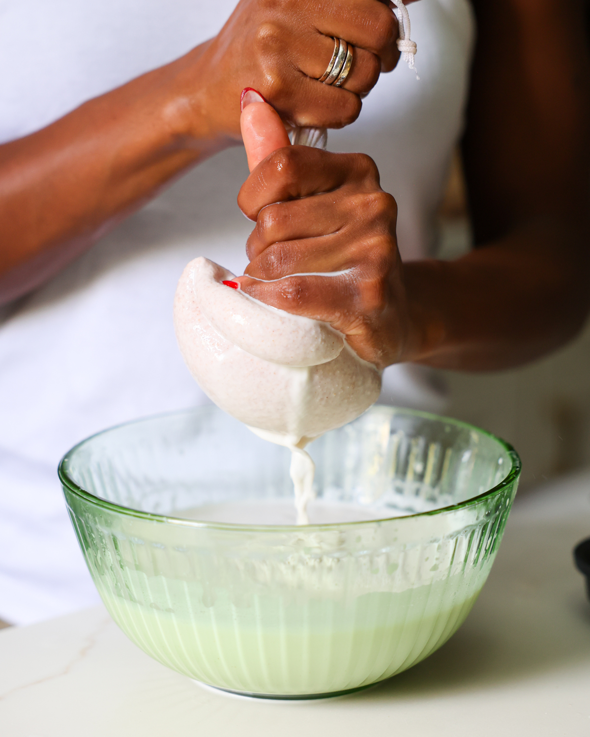 squeezing nut milk bag