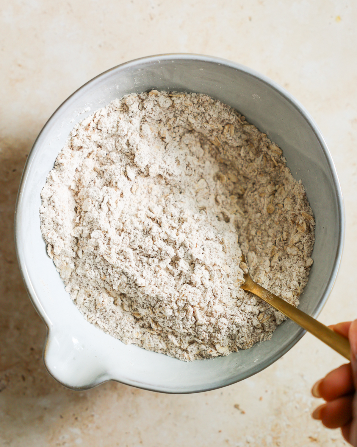 overhead stirring the oat topping