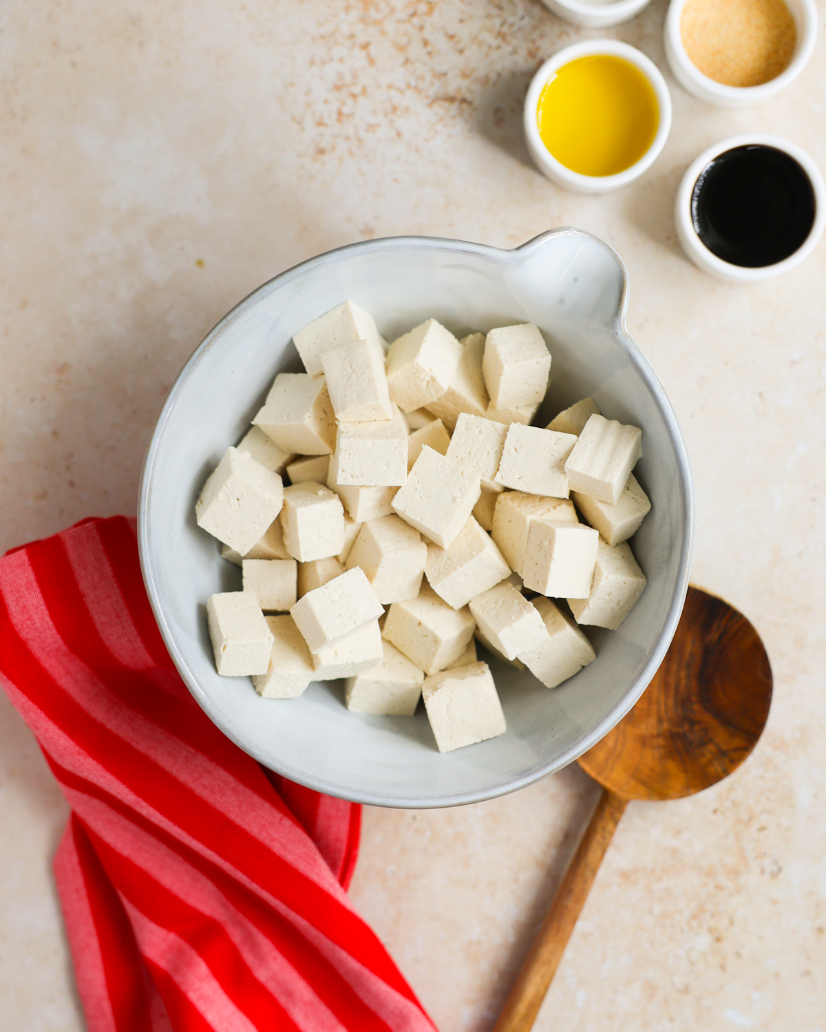 overhead plain tofu cubes in mixing bowl
