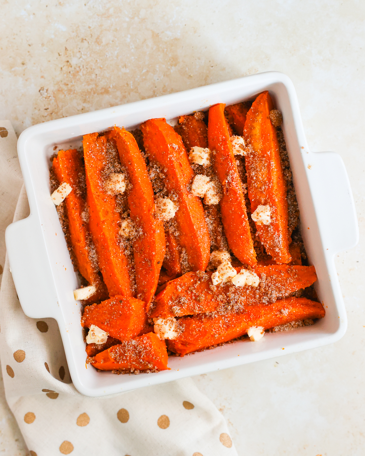 layered sweet potatoes in baking dish